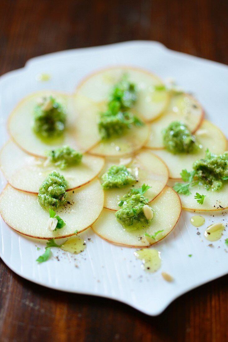 Slices of apple topped with courgette paste