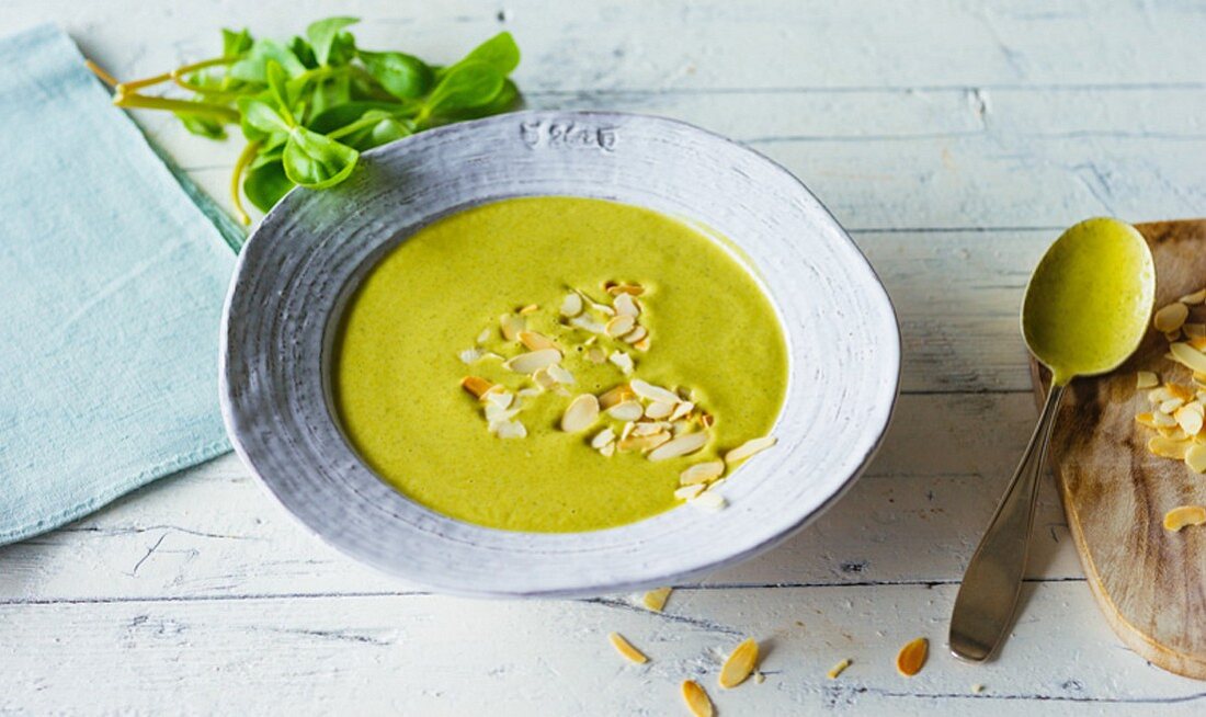 Purslane and courgette soup with almond mousse