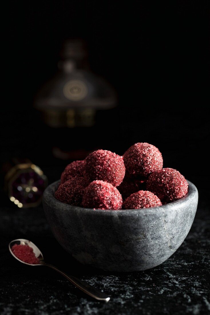 Raspberry truffles rolled in coloured sugar