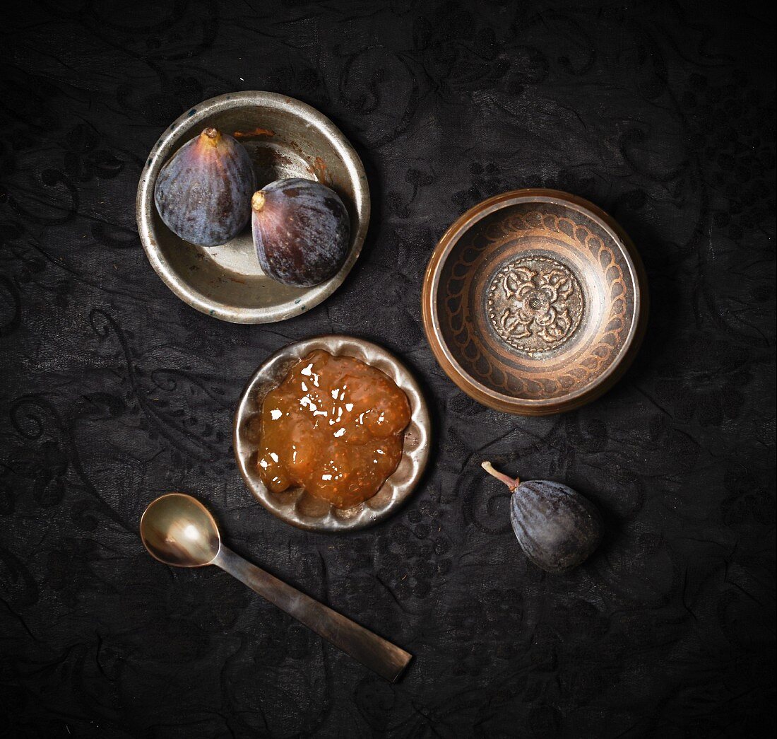 An arrangement of fresh figs and fig jam