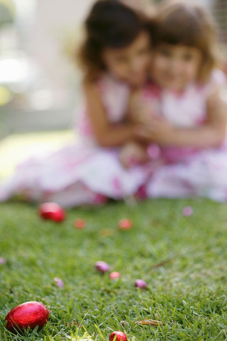 Girls looking for Easter eggs in the garden