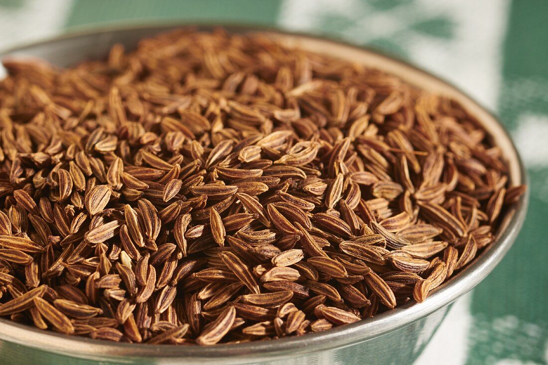 Caraway seeds in a metal bowl