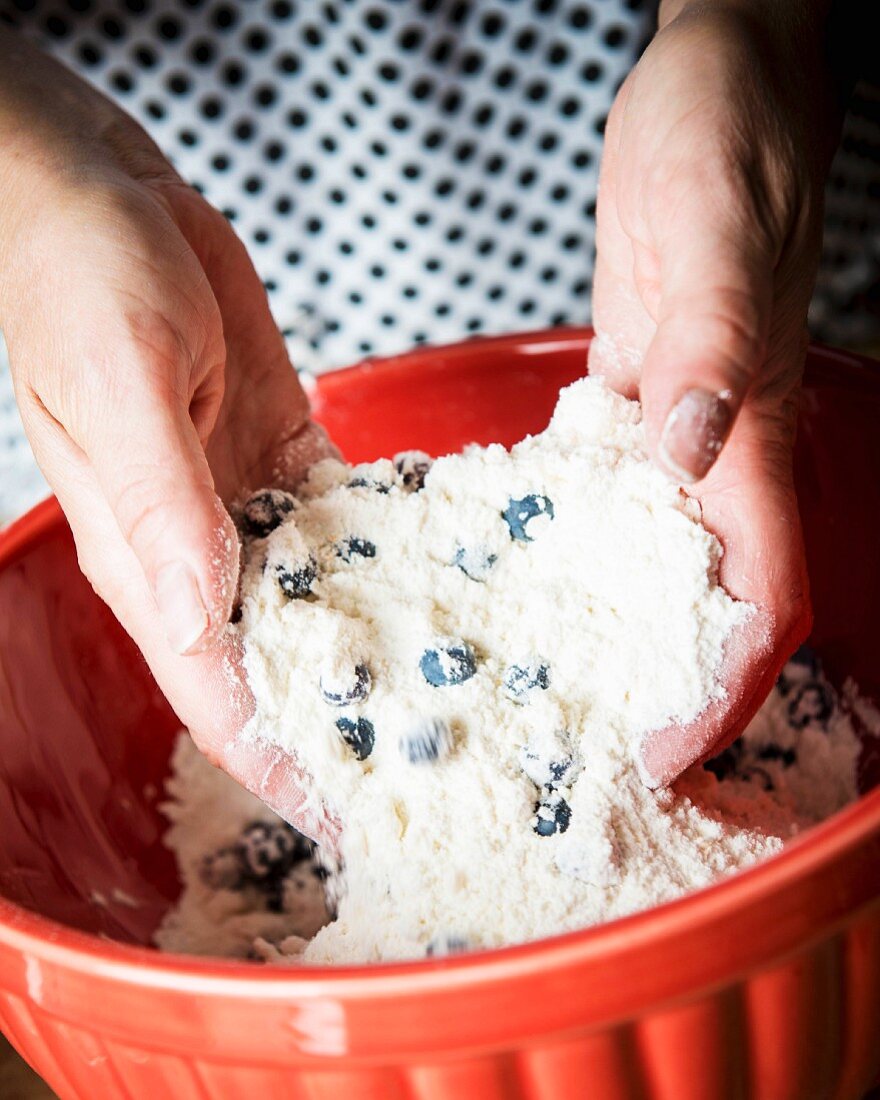 Blueberry scone dough being kneaded