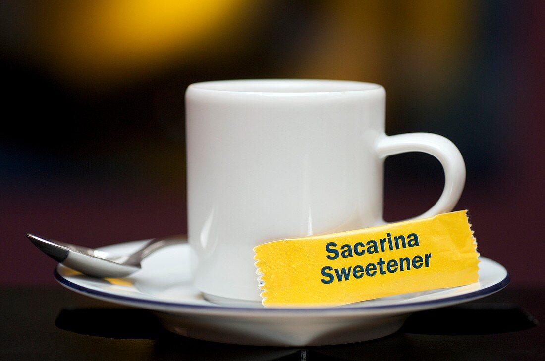 Sweetner and a cup of coffee