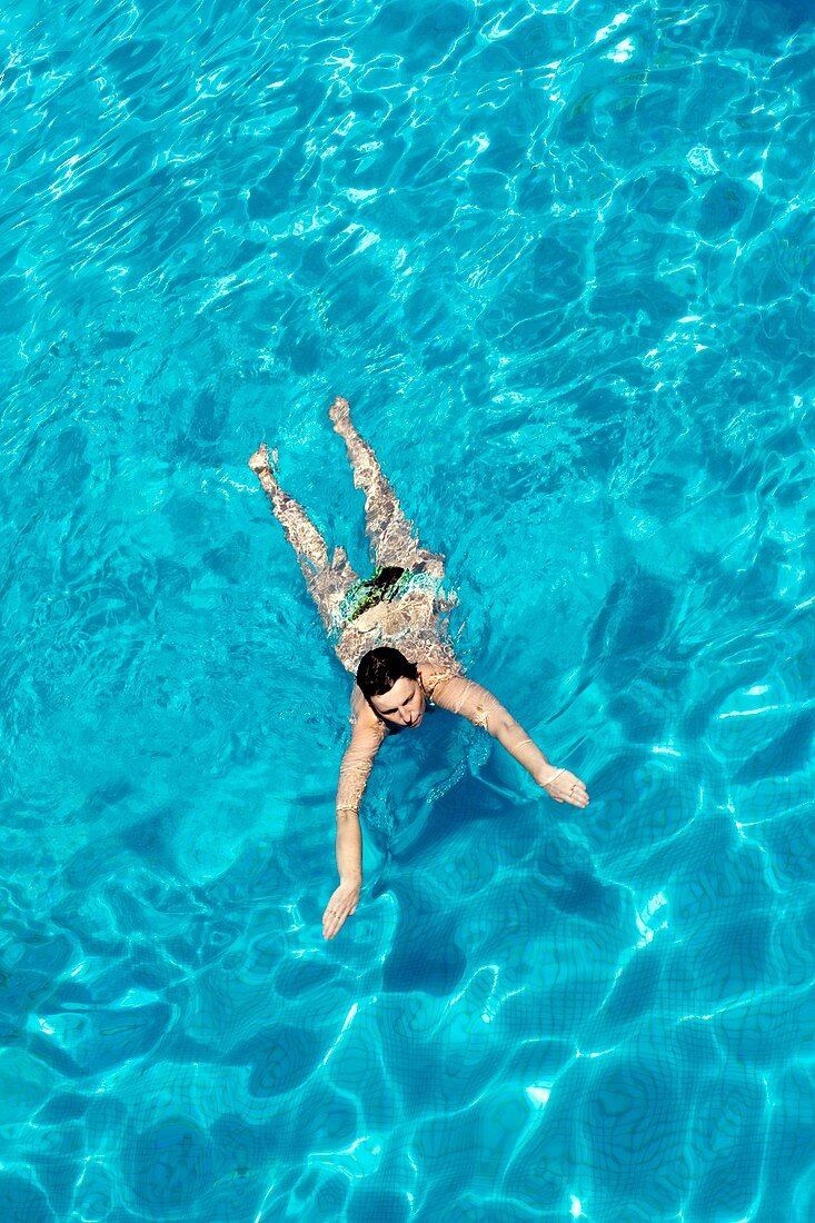 Woman swimming in a pool