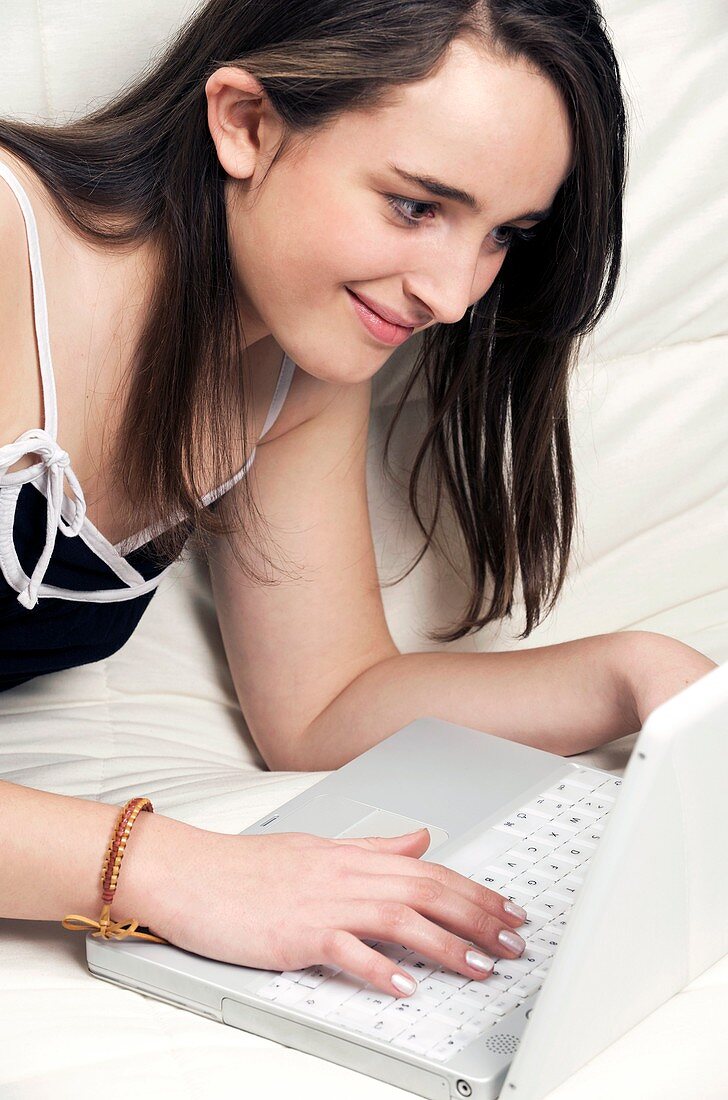 Teenage girl using a laptop computer