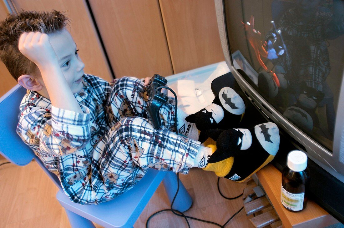 Sick child playing a games console