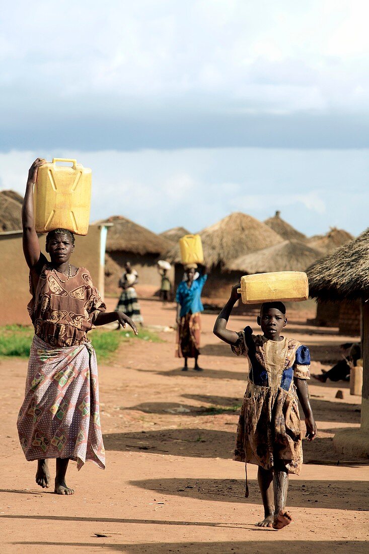 Women and children carrying water,Uganda