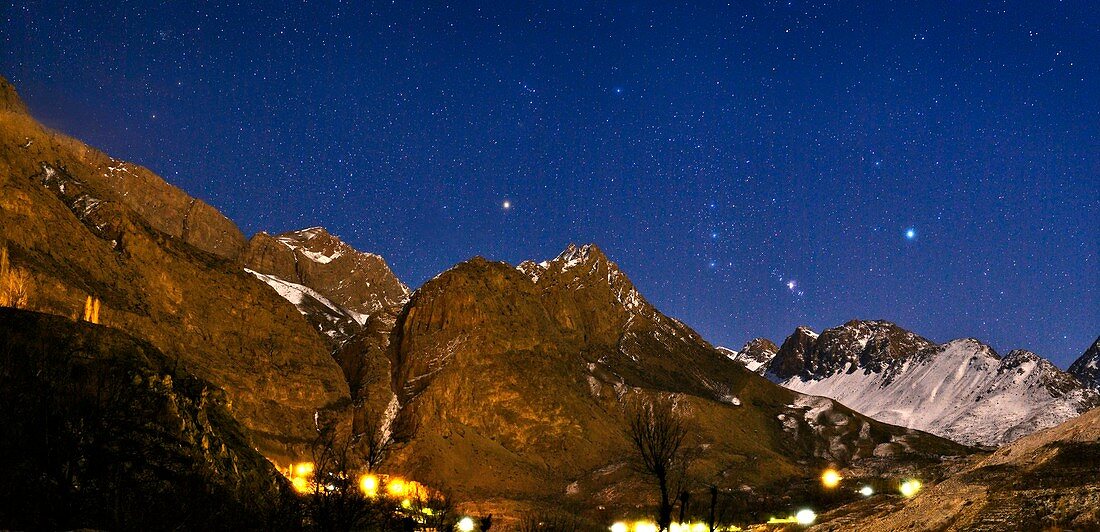 Winter stars above mountains