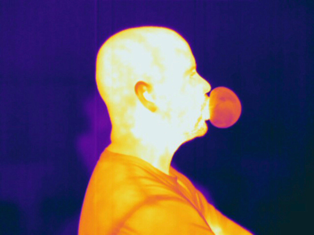 Thermogram showing a man blowing a bubble