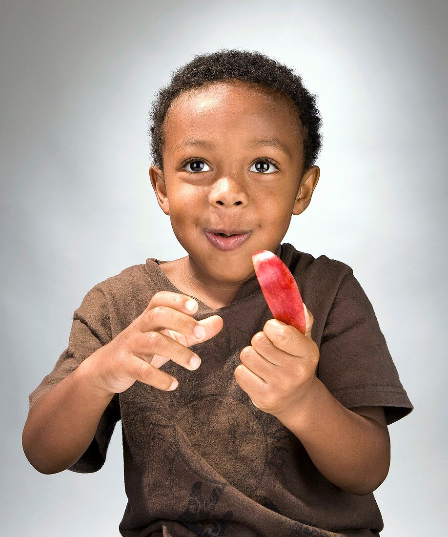 Boy eating fruit