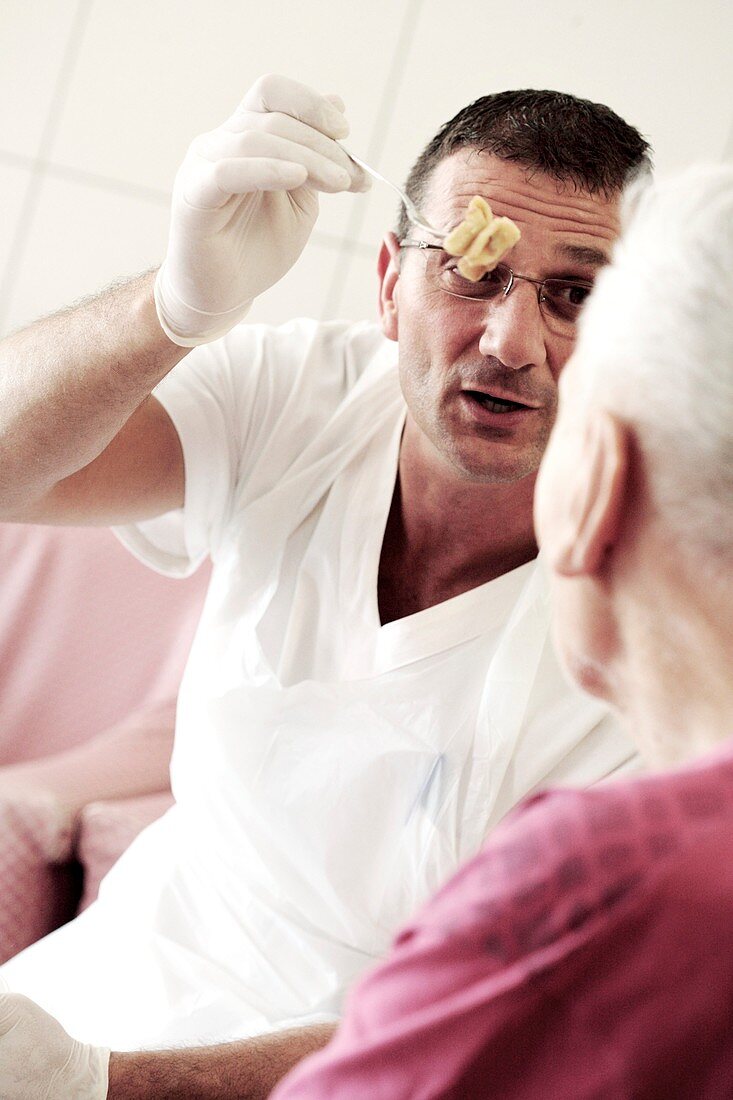 Alzheimer's disease nurse with patient