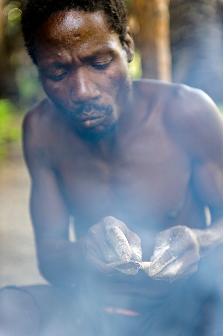 Hunter preparing poison arrow,Tanzania