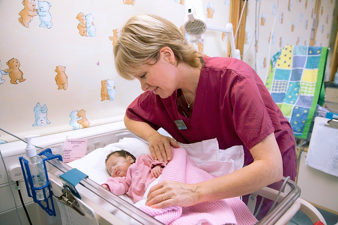 Nurse and newborn baby