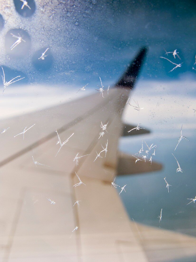 Aircraft window ice crystals