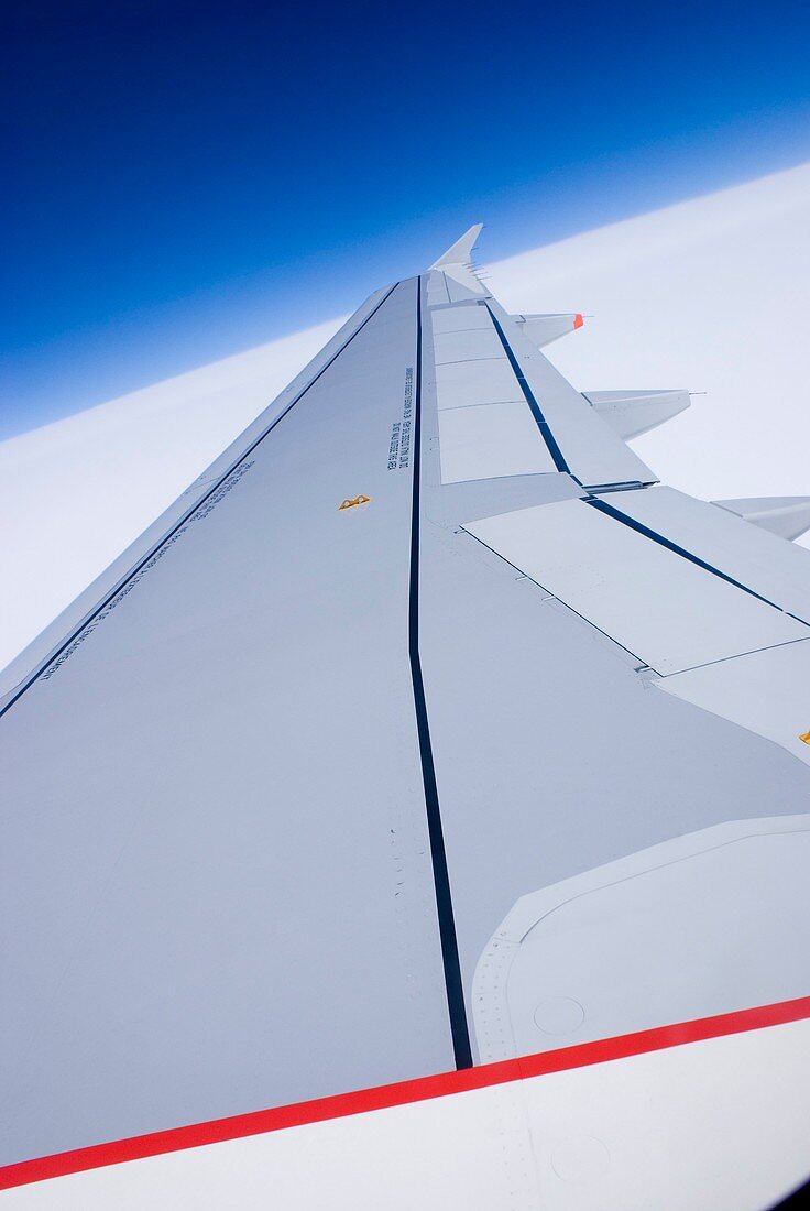 Aircraft wing and blue sky