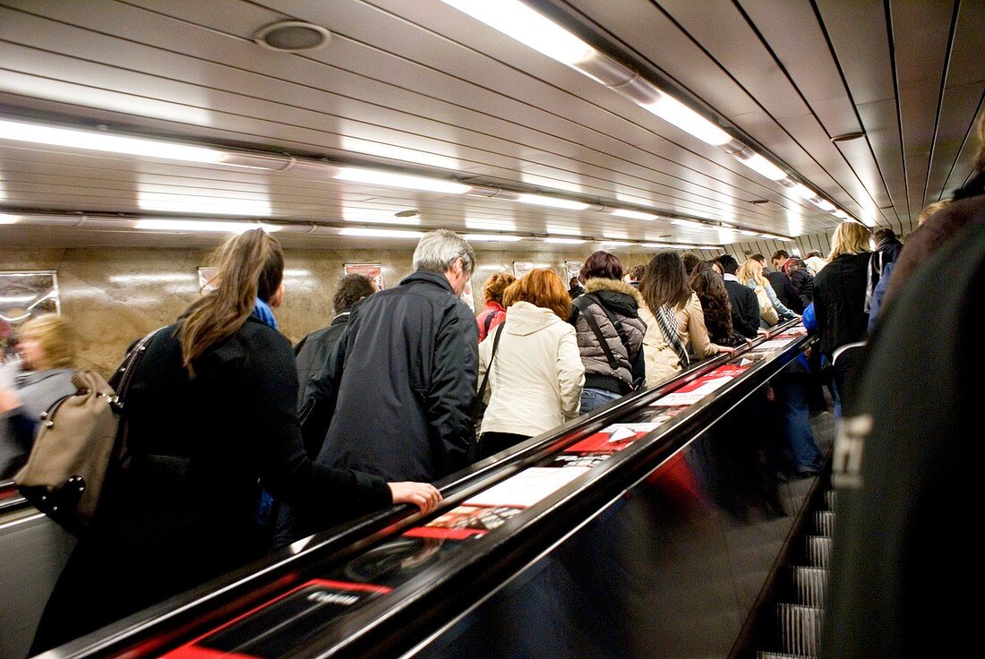 Commuters on escalators in Prague metro