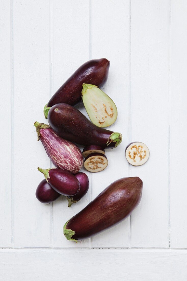 Aubergines, whole and halved