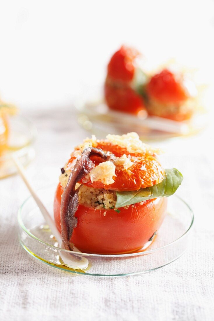 A stuffed tomato with quinoa and anchovies