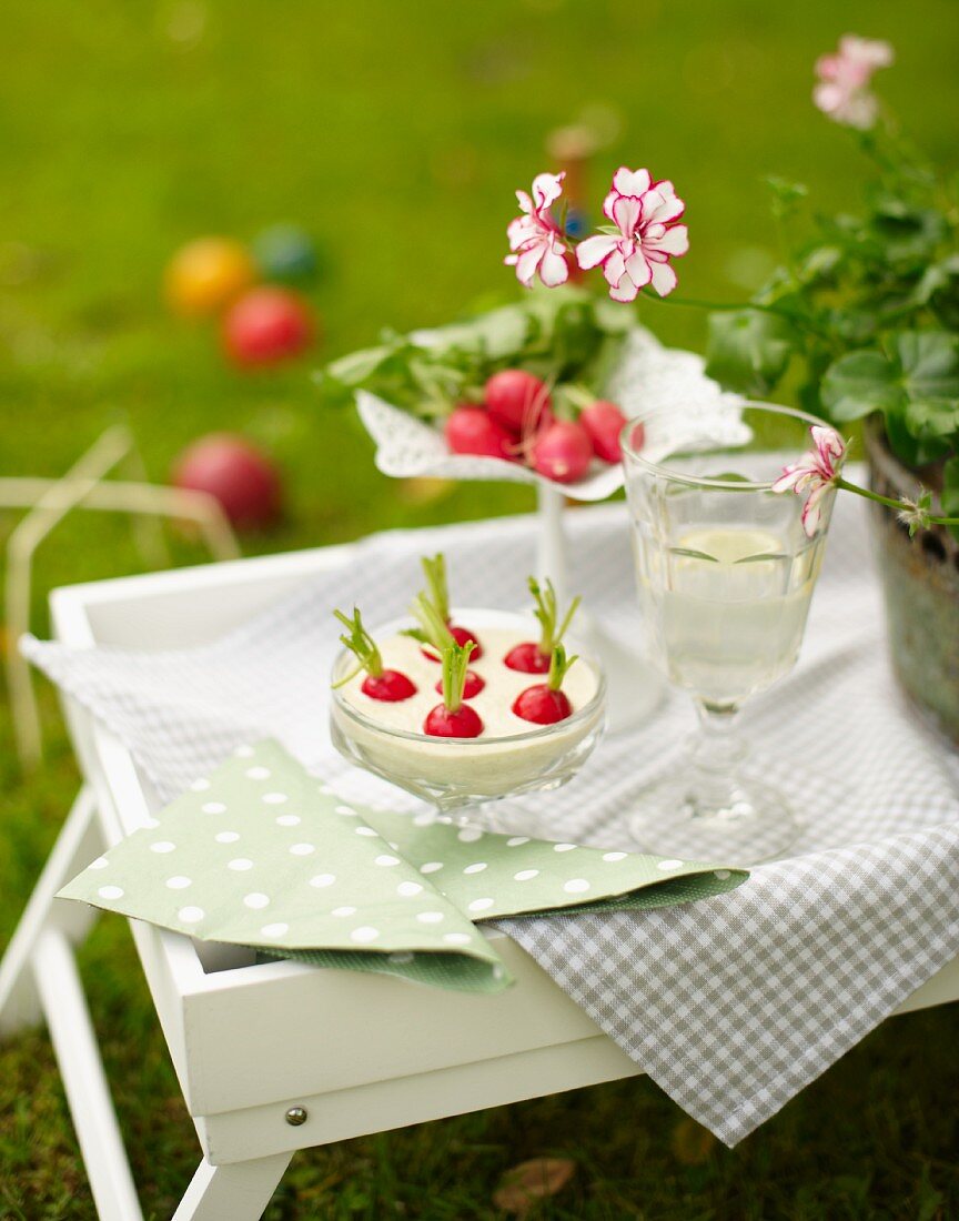 A radish snack with an olive dip for a croquet garden party