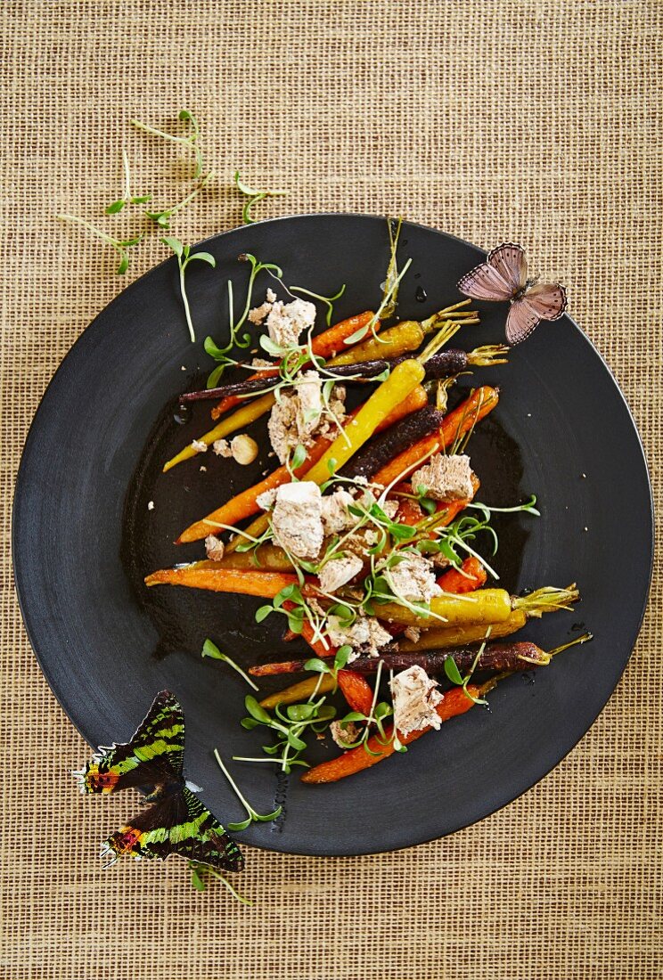 Colourful carrot salad with almond nougat and cress