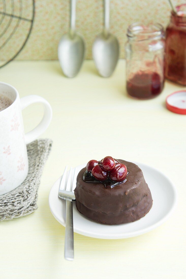 A mini chocolate cake with cranberry sauce