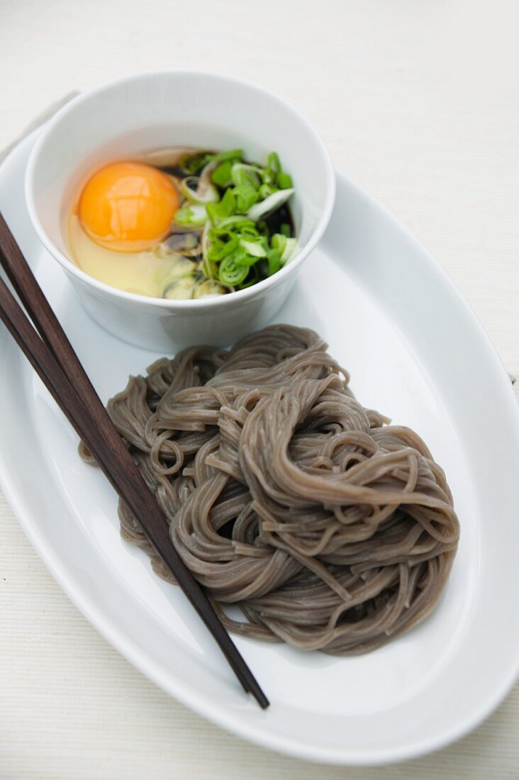 Cold soba noodles with raw egg and spring onions