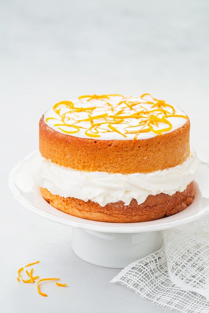 An orange cake with cream