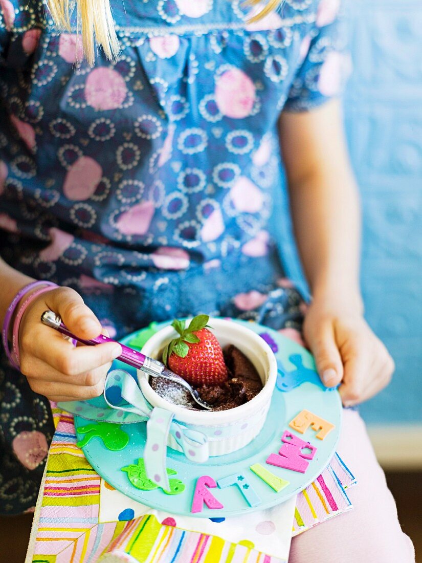 Chocolate souffle with strawberries