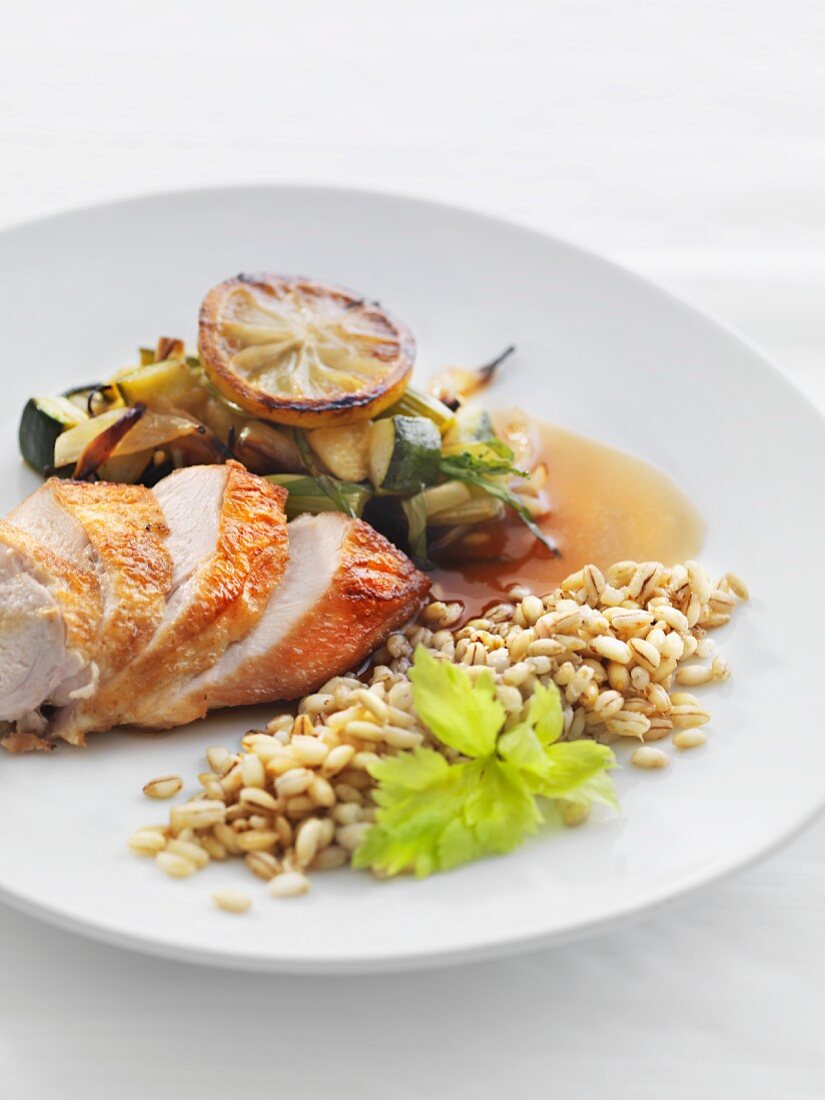 Roast chicken breast with wheat barley and a lemon medley