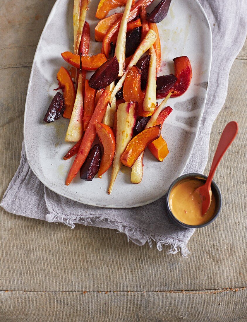 Oven roasted winter vegetables with a pepper and mango dip