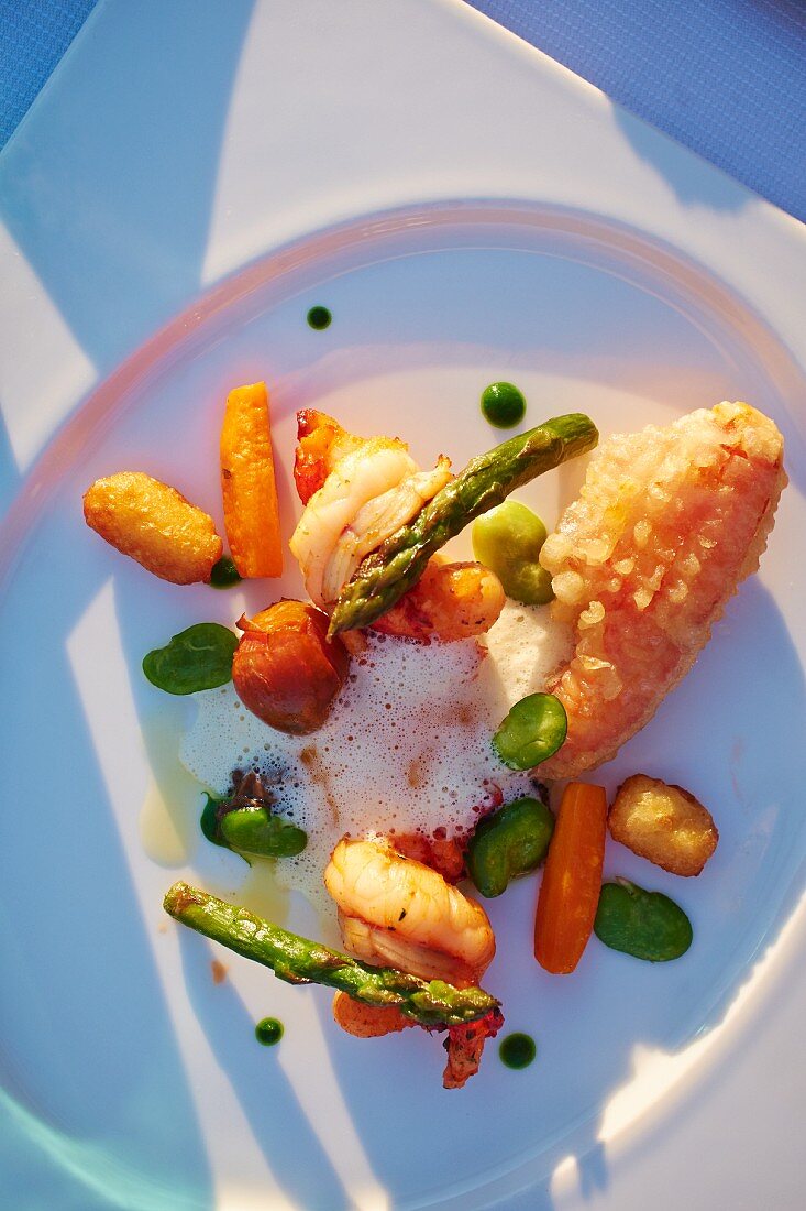 Lobster with vegetables and potato croquettes