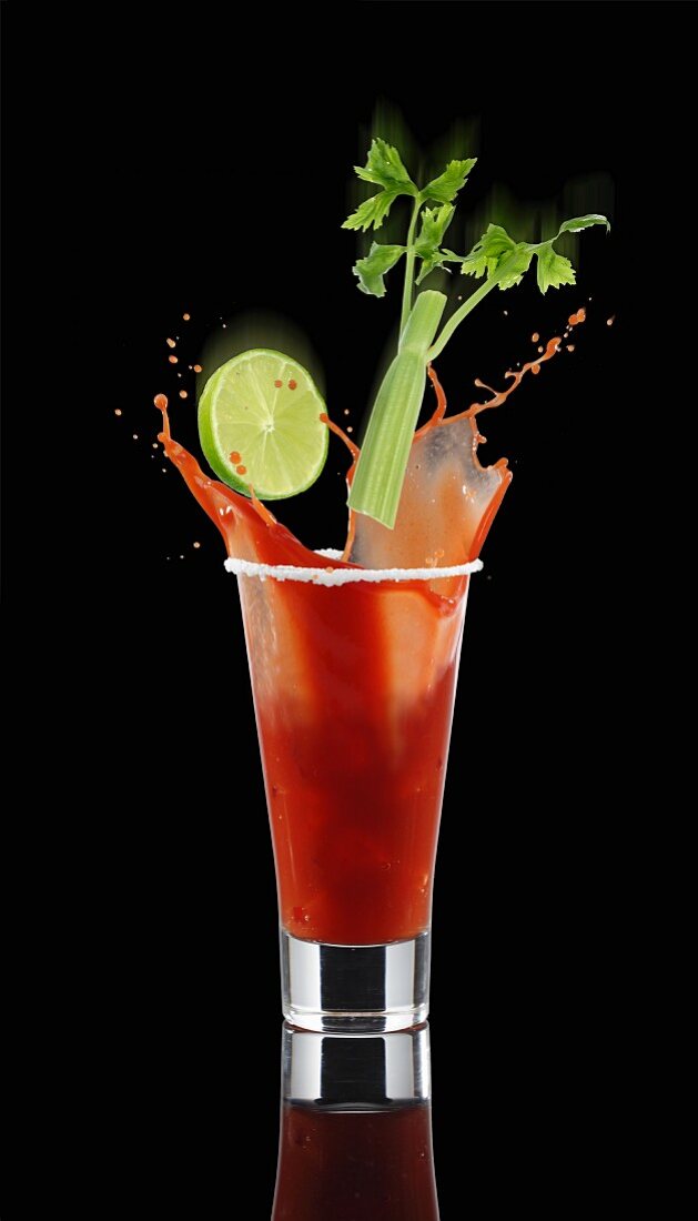 A Bloody Mary splashing out of the glass