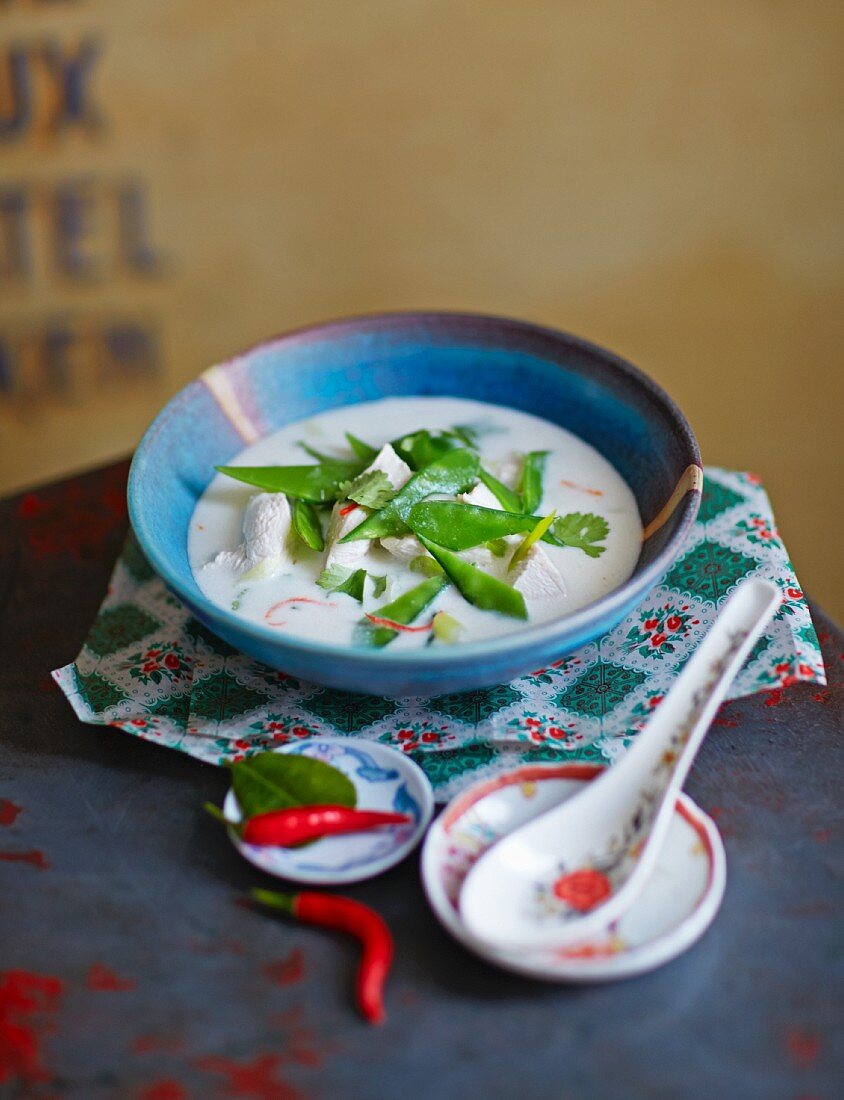 Coconut soup with chicken and mange tout
