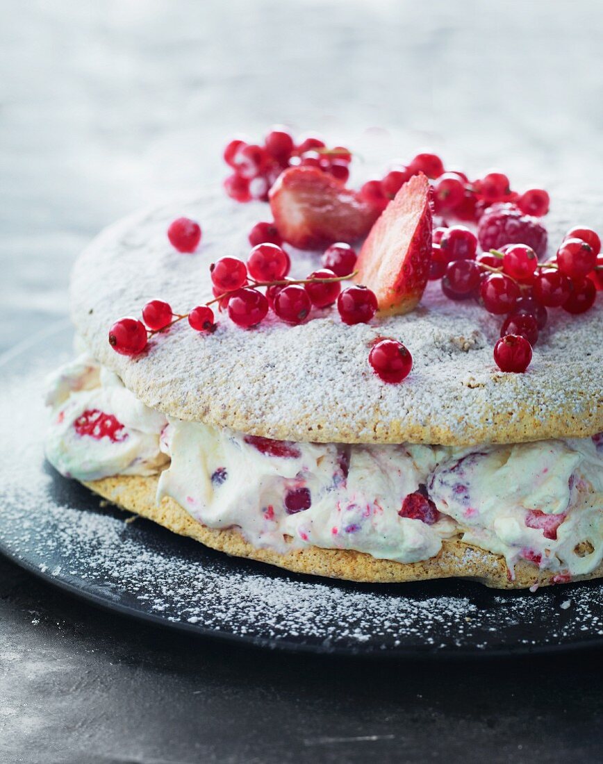 A strawberry and redcurrant cake with mascarpone cream