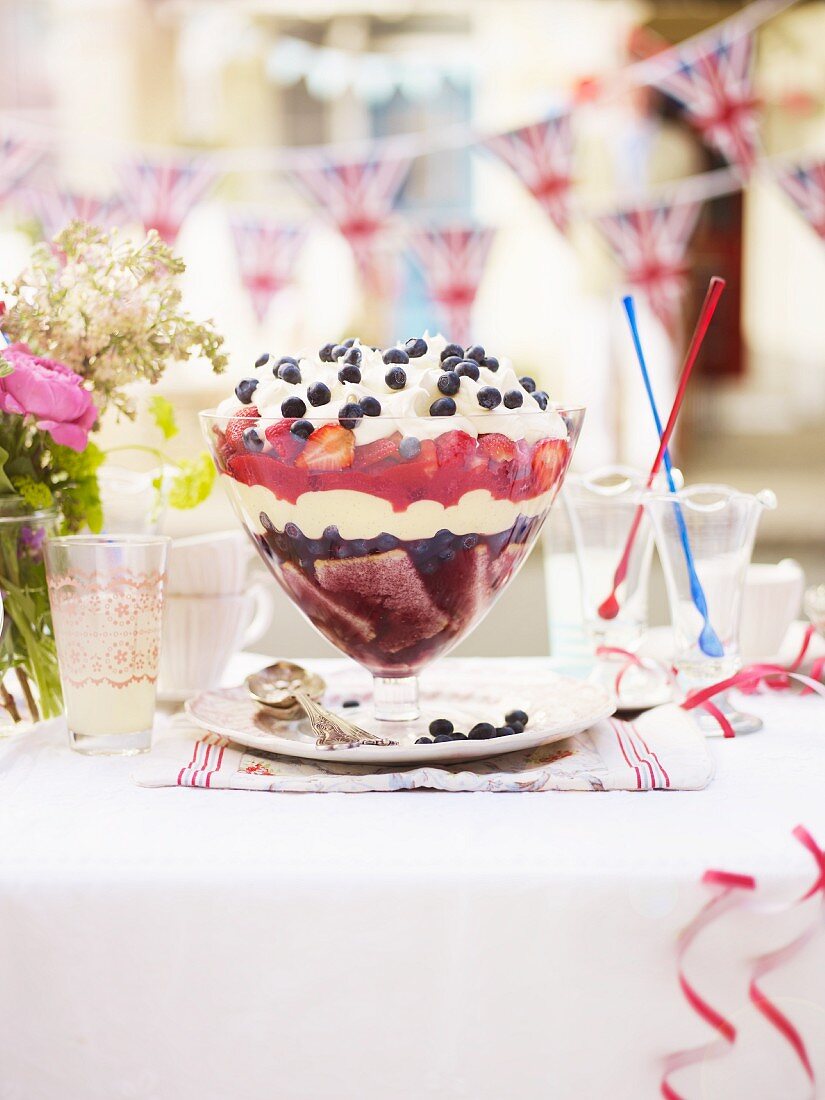 A summer berry trifle topped with cream