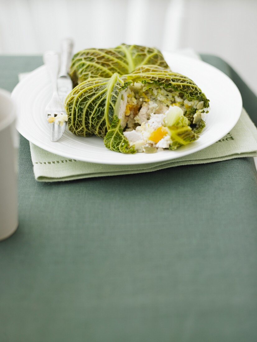 Stuffed savoy cabbage leaves filled with chicken, couscous and apricots