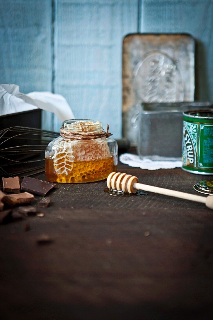 A honeycomb in a jar and chocolate