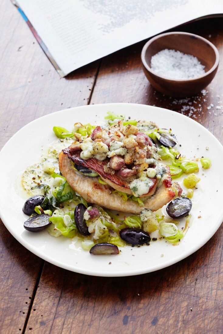 A stuffed turkey escalope on a leek medley with grapes