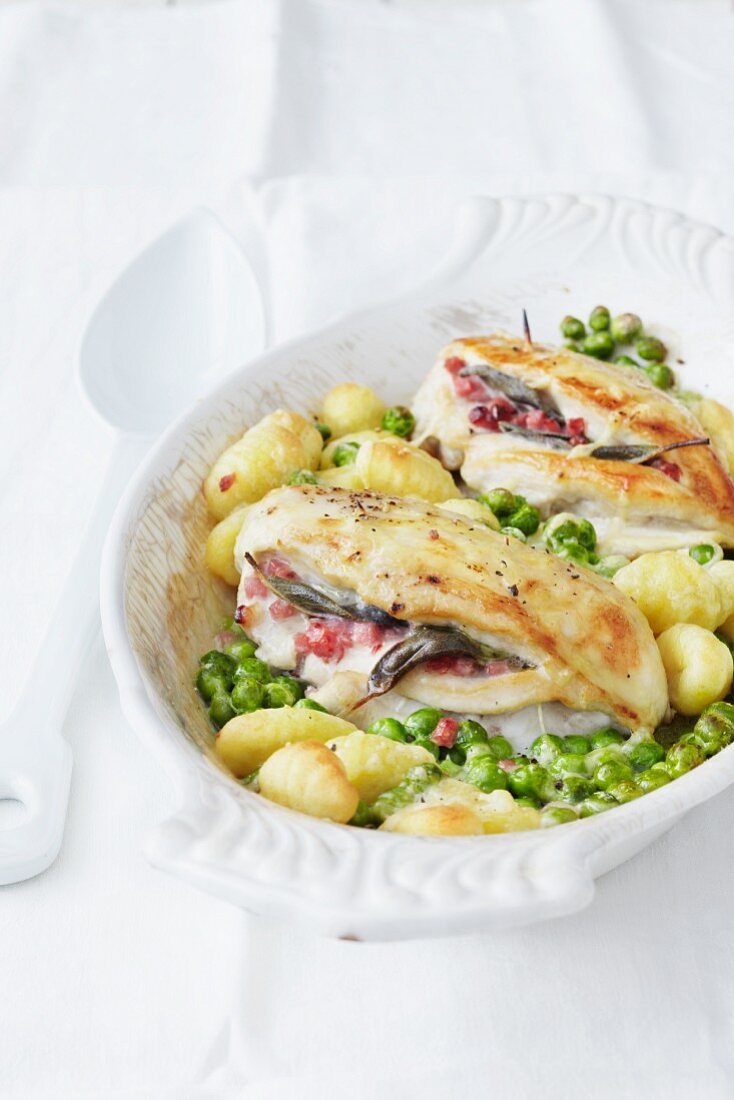 Chicken saltimbocca on a bed of gnocchi with peas