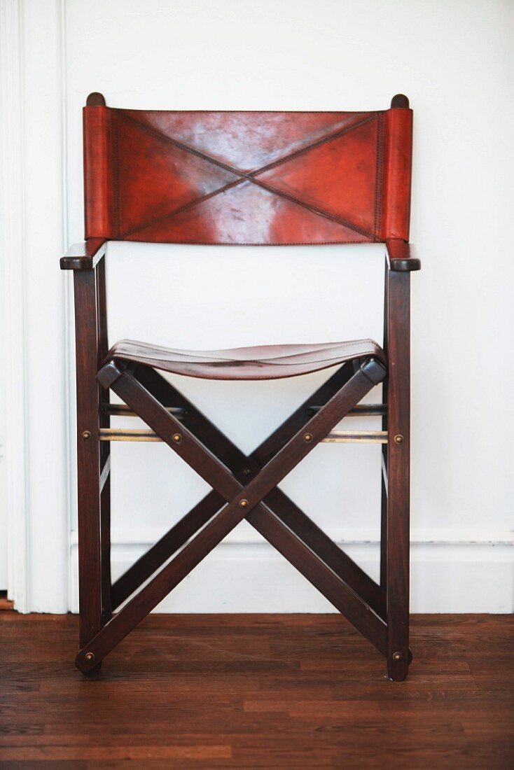 Classic, wooden folding chair with leather seat and backrest