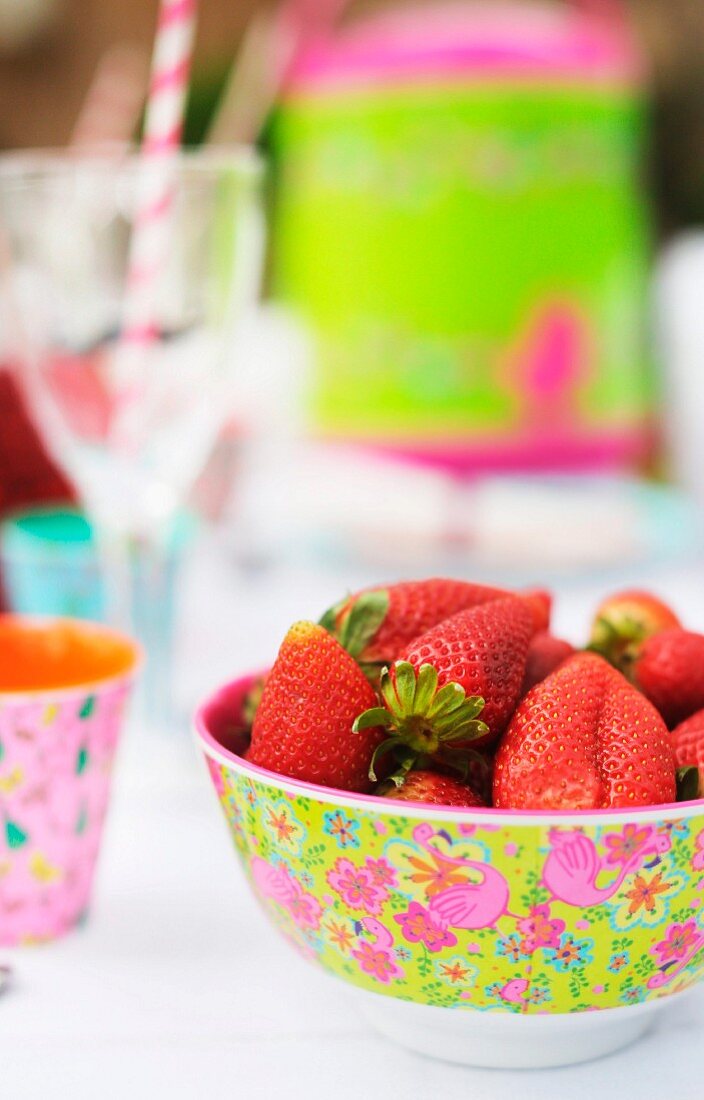 Strawberries in floral plastic bowl