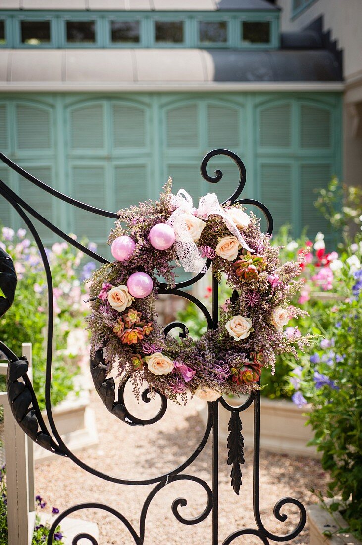 Wreath decorated with flowers and baubles