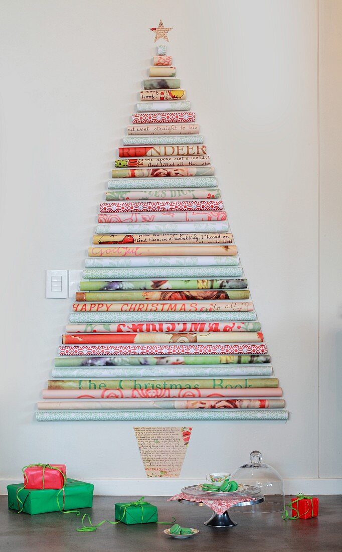 Stylised Christmas tree made from various rolls of patterned wall on wall