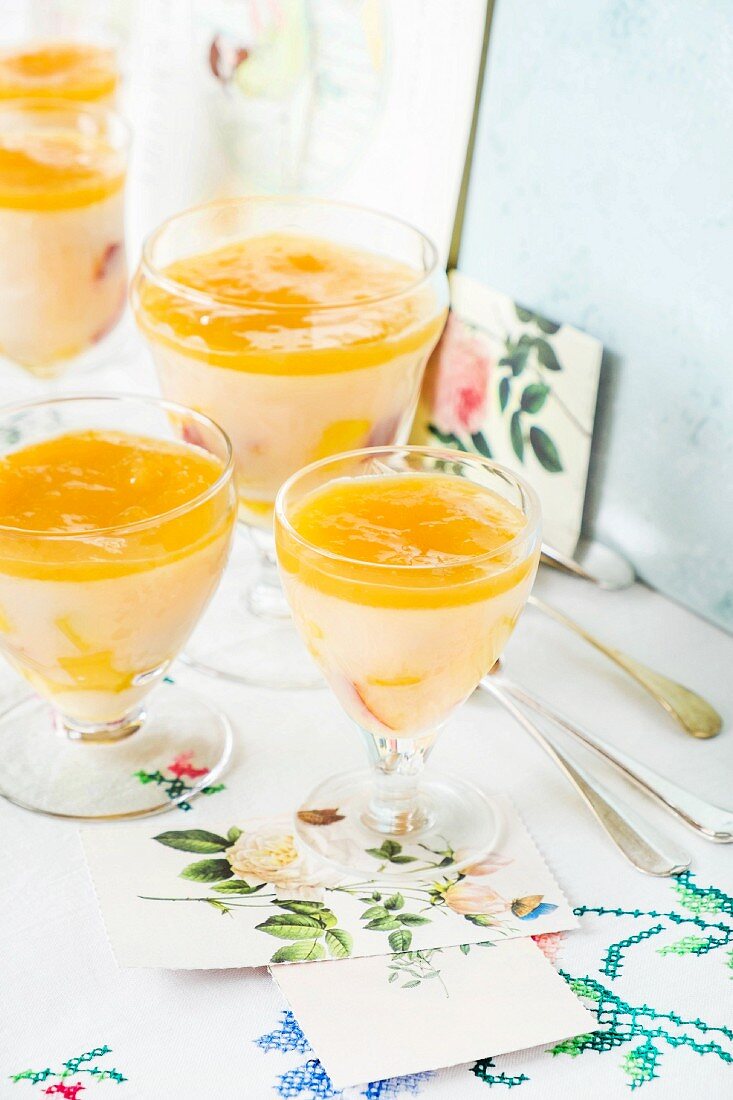 Mango and peach pudding in desert glasses