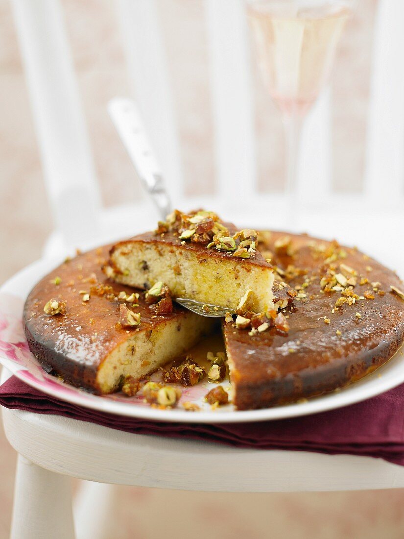 Sliced orange and lemon cake with pistachio nuts for Christmas