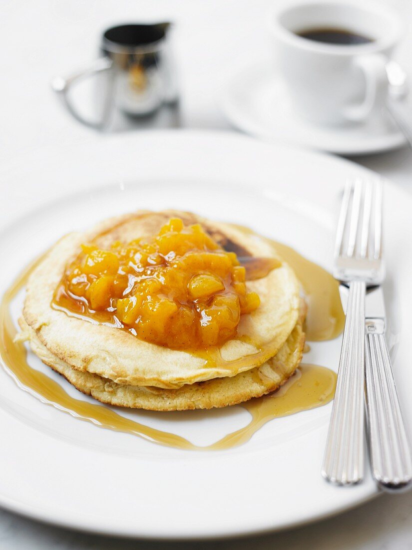 Pancakes with apricot compote and maple syrup