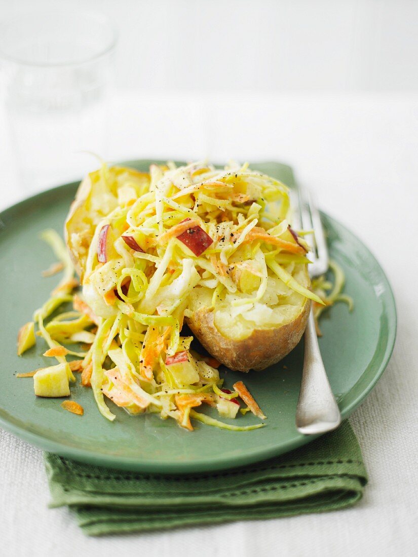 A baked potato with coleslaw