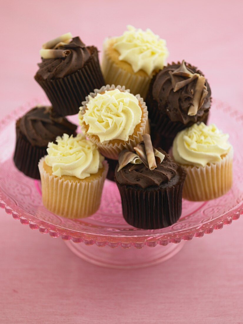 Lemon and chocolate cupcakes on a cake stand