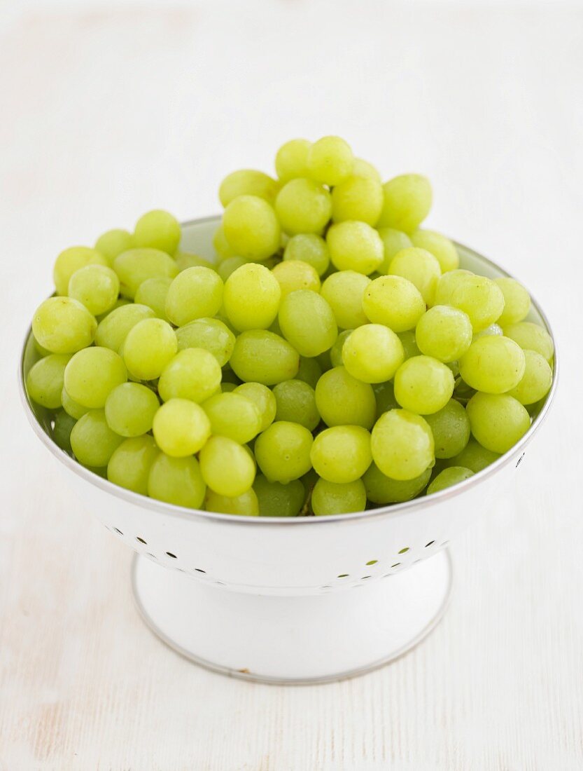 Green grapes in an enamel colander